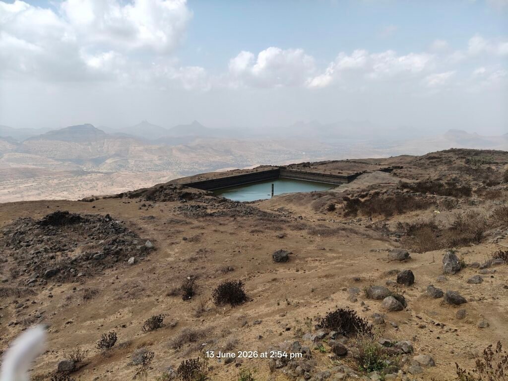 Rock-cut water tank on the summit plateau of Salher fort