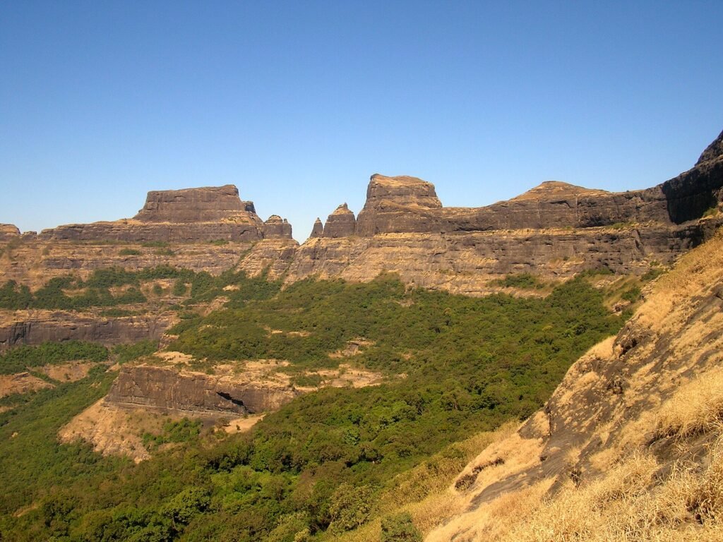 Alang, Madan and Kulang forts seen together as a rocky range in the Kalsubai range
