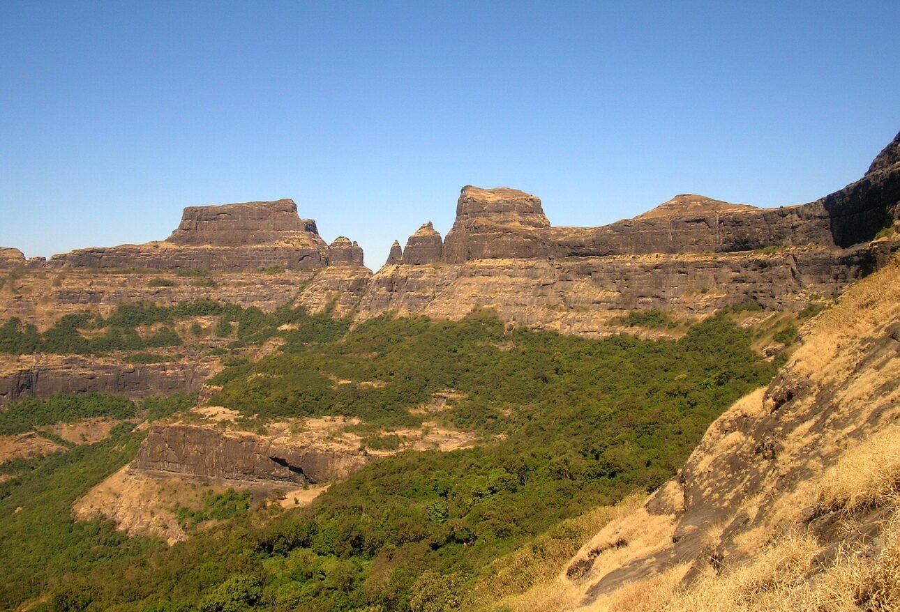 Alang, Madan and Kulang forts seen together as a rocky range in the Kalsubai range